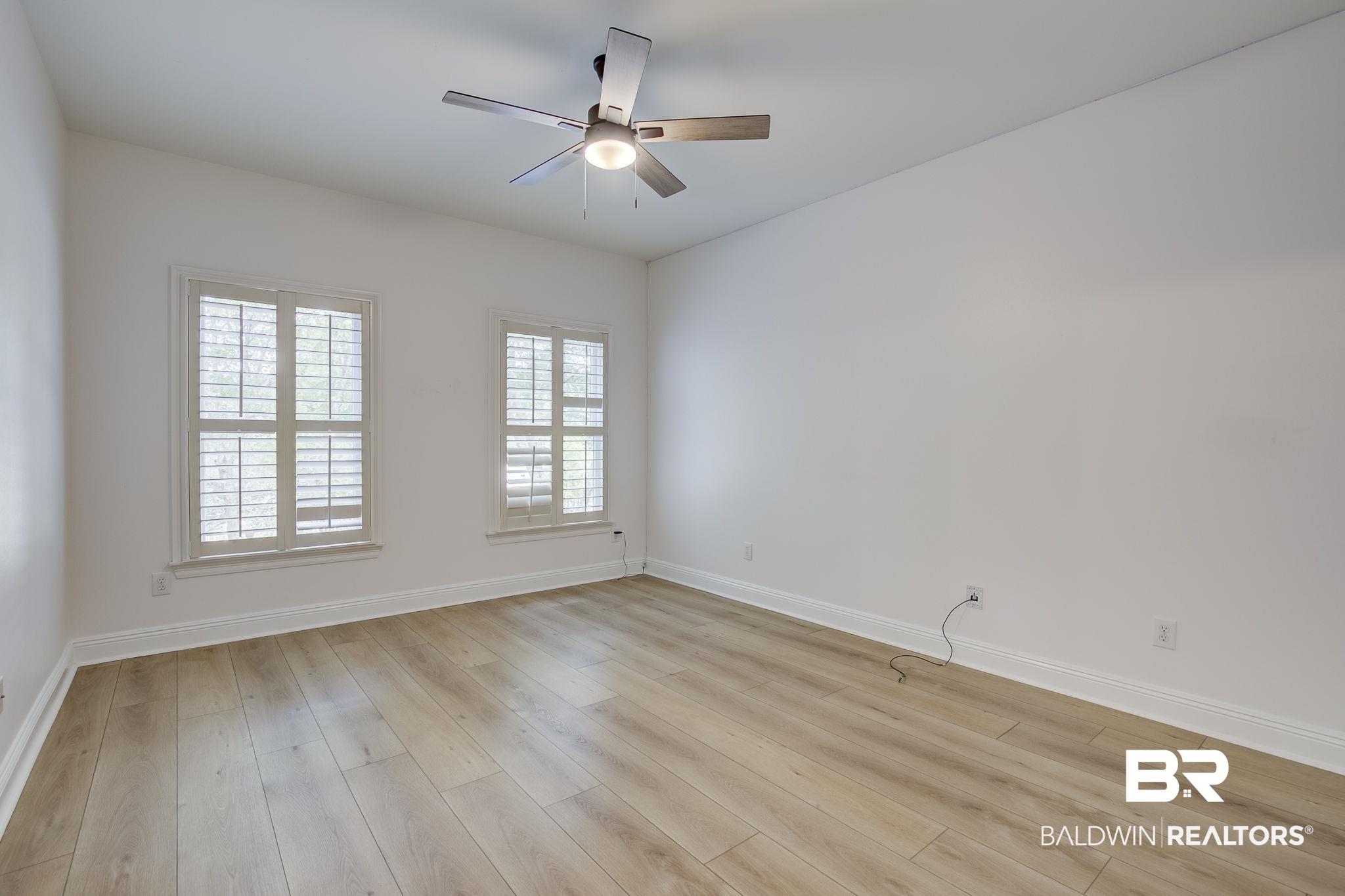 105 High Pines Ridge Fairhope, AL 36532 - Photo 69 of 97 Spare room with baseboards, light wood finished floors, and a ceiling fan