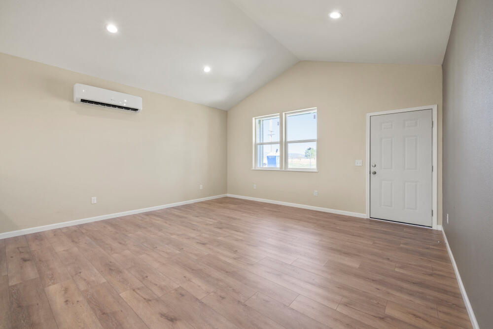 330 North Elm Street Merrill, OR 97633 - Photo 23 of 23 an empty room with wooden floor and windows