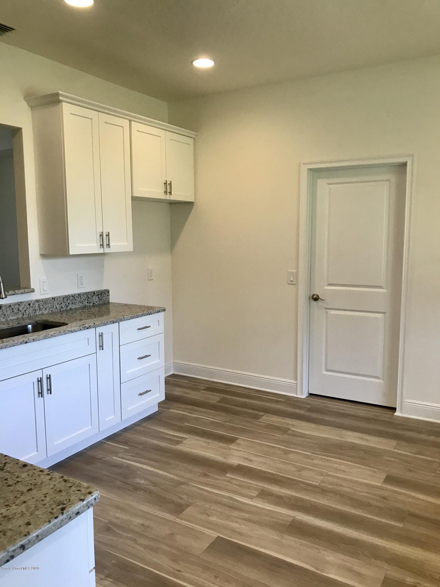 4913 Bridge Road Cocoa, FL 32927 - Photo 4 of 16 Kitchen leading to Laundry Room