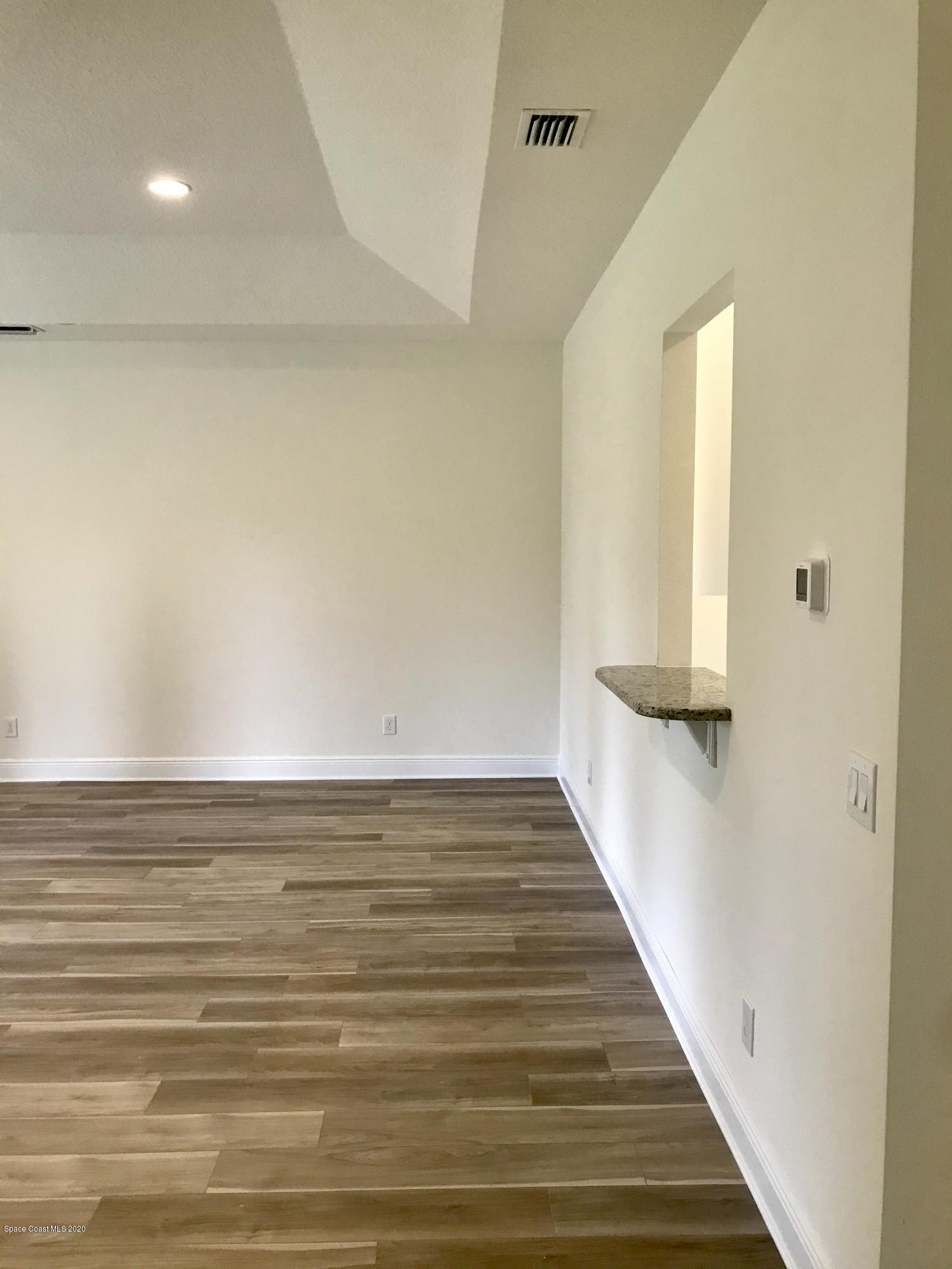 4913 Bridge Road Cocoa, FL 32927 - Photo 5 of 16 Great Room and Kitchen Bar