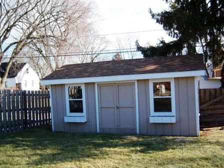 1100 Frederick Street Joliet, IL 60435 - Photo 14 of 15 a front view of a house with a yard