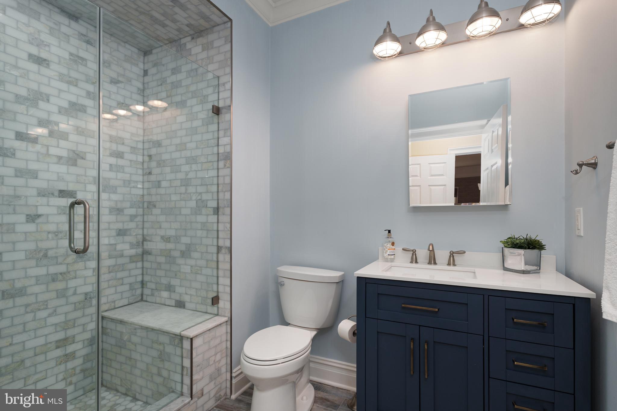 24 Michael Way Pennington, NJ 08534 - Photo 19 of 50 a bathroom with a toilet a sink a shower and mirror