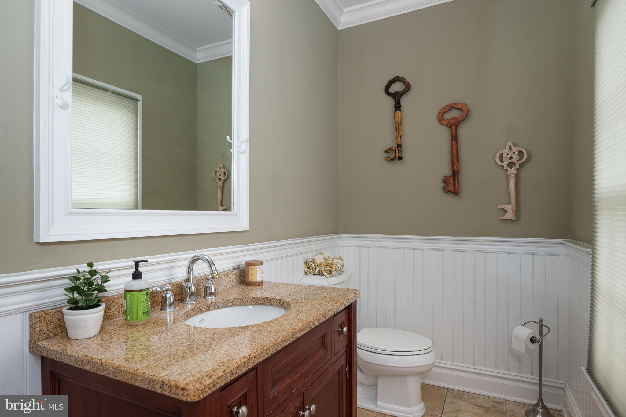 24 Michael Way Pennington, NJ 08534 - Photo 20 of 50 a bathroom with a granite countertop sink a toilet and a mirror