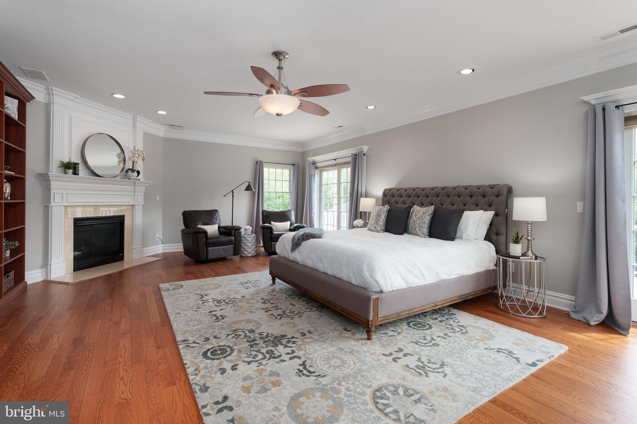 24 Michael Way Pennington, NJ 08534 - Photo 22 of 50 a bedroom with a large bed and a fireplace
