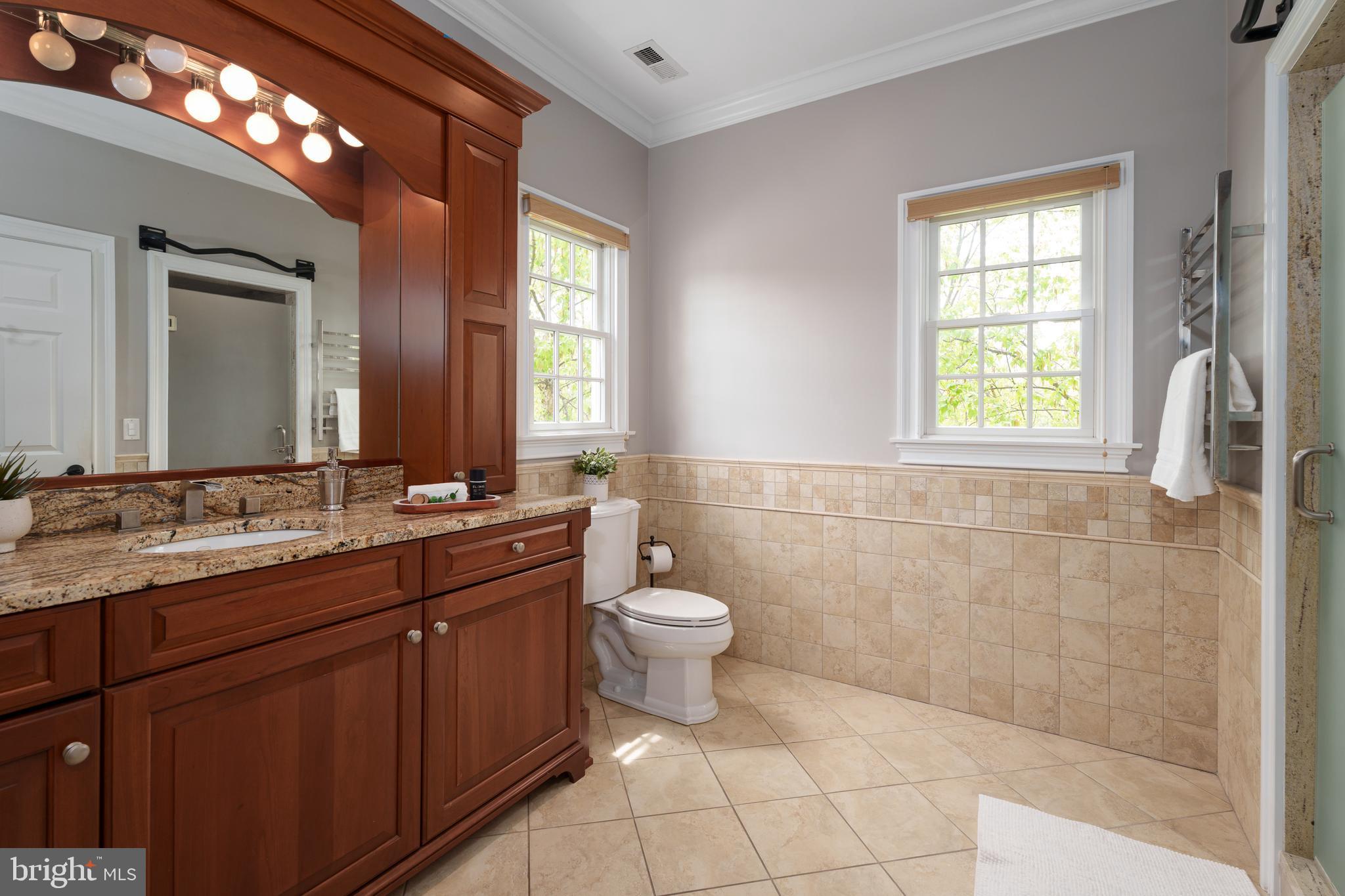 24 Michael Way Pennington, NJ 08534 - Photo 28 of 50 a bathroom with a double vanity sink a toilet and a mirror