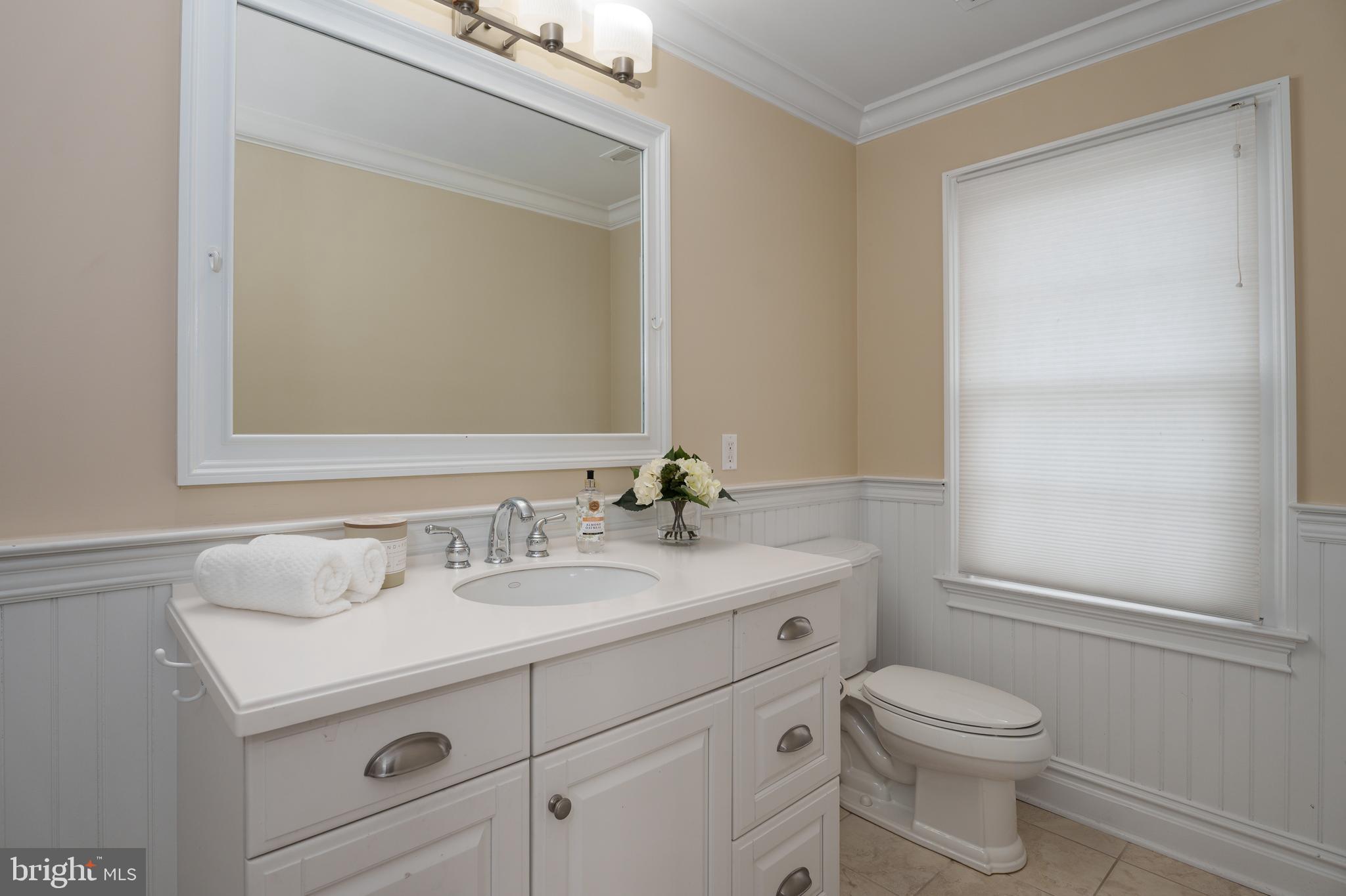 24 Michael Way Pennington, NJ 08534 - Photo 36 of 50 a bathroom with a sink a toilet and a mirror