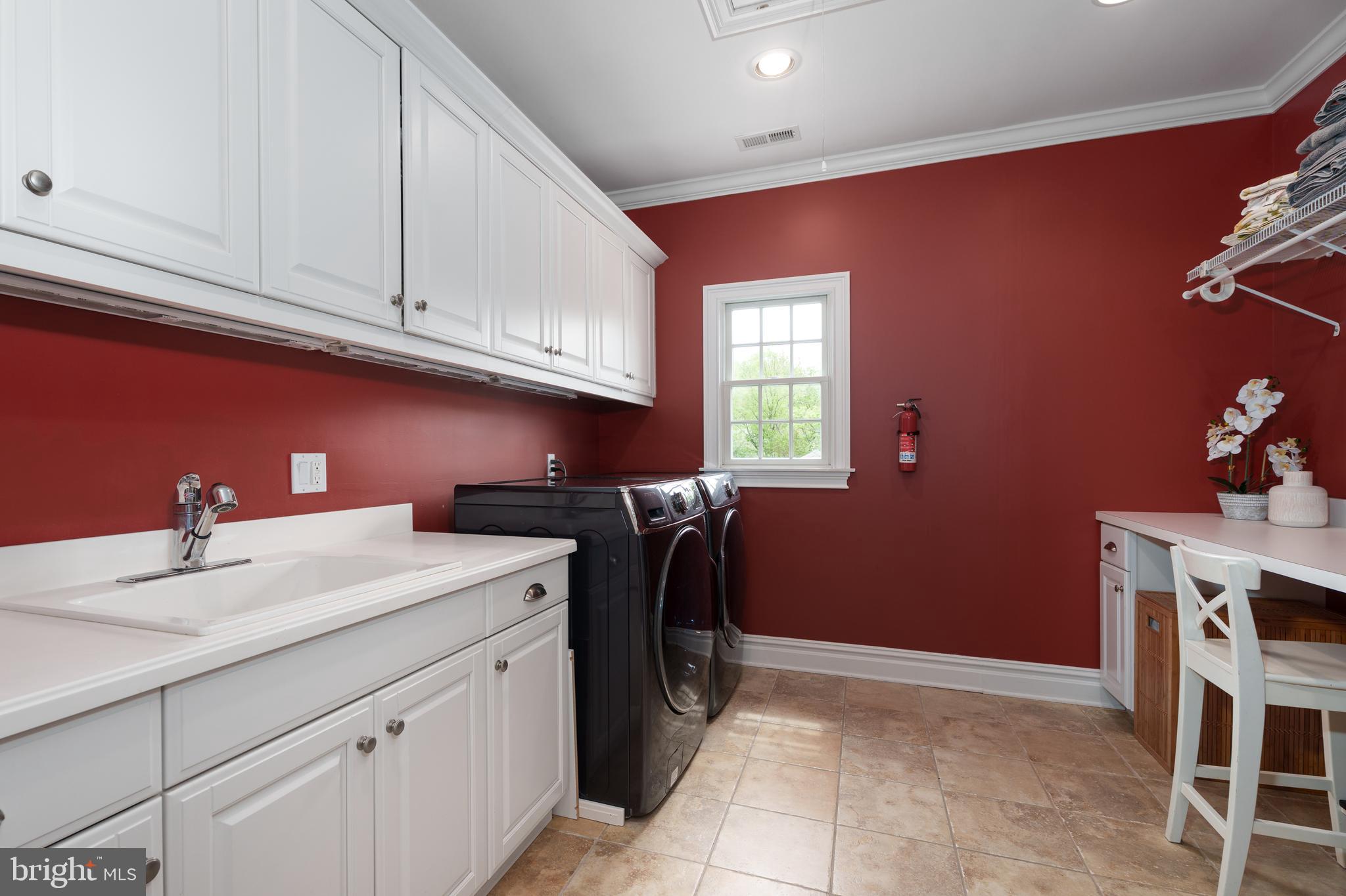 24 Michael Way Pennington, NJ 08534 - Photo 37 of 50 a utility room with cabinets washer and dryer