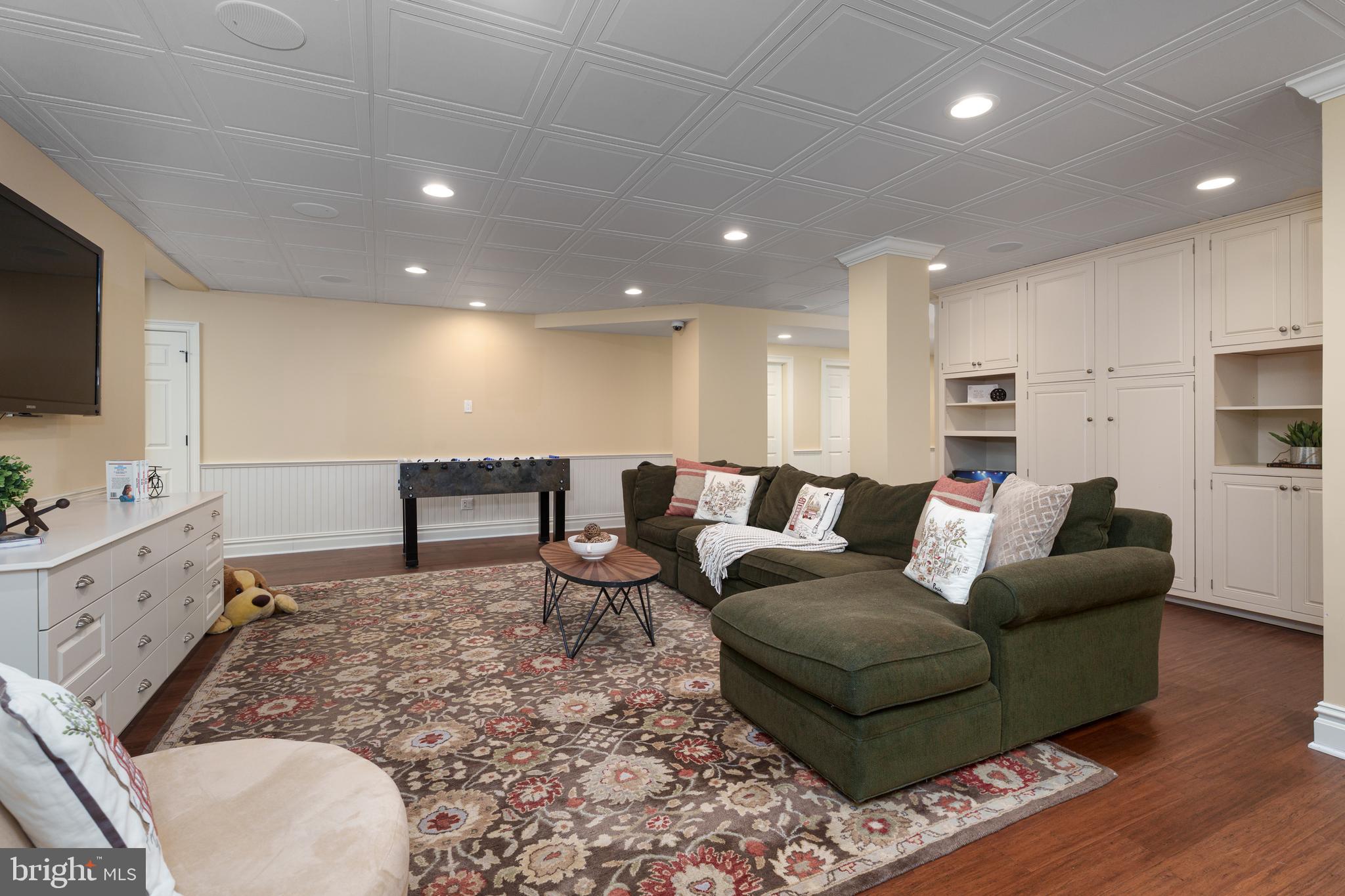 24 Michael Way Pennington, NJ 08534 - Photo 39 of 50 a living room with furniture and a flat screen tv