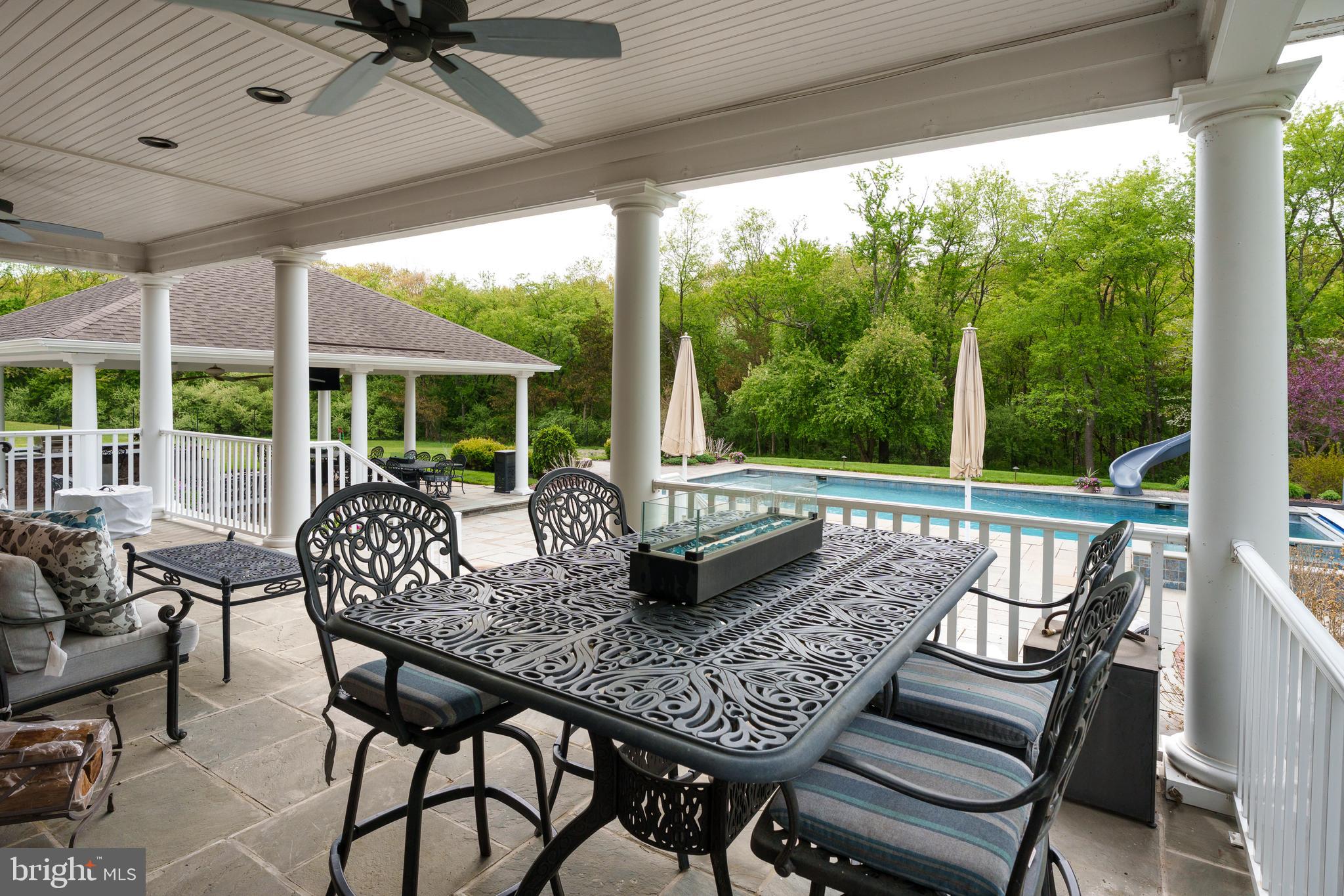 24 Michael Way Pennington, NJ 08534 - Photo 48 of 50 a view of a patio with a table chairs and a table