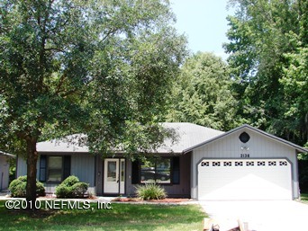 2136 Rothbury Drive Jacksonville, FL 32221 - Photo 2 of 18 a front view of a house with a yard