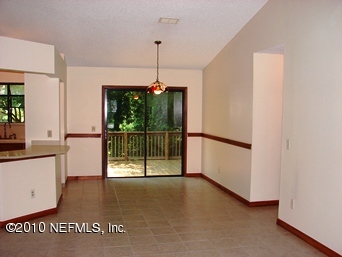 2136 Rothbury Drive Jacksonville, FL 32221 - Photo 8 of 18 a view of a room with a floor to ceiling window and wooden floor