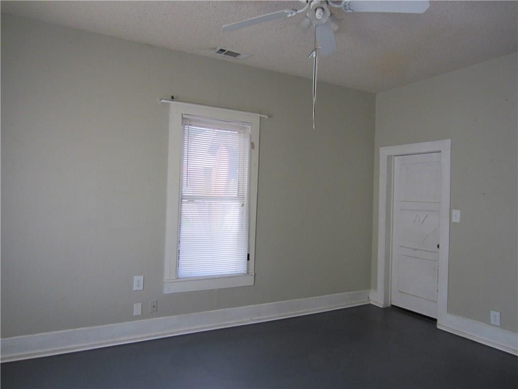 1102 Peak Street Denton, TX 76201 - Photo 6 of 11 an empty room with a window