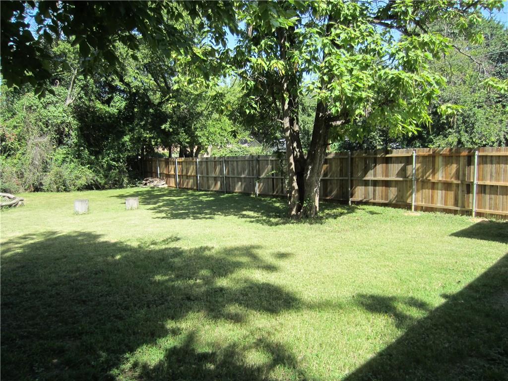 1102 Peak Street Denton, TX 76201 - Photo 9 of 11 a view of a backyard with a small cabin