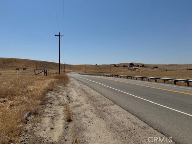 13300 Round Mountain Road Bakersfield, CA 93308 - Photo 9 of 13 a view of an empty room with wooden floor