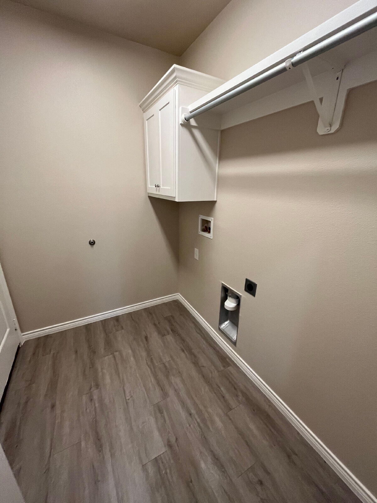 7010 12th Street Lubbock, TX 79416 - Photo 11 of 13 a view of storage and utility room with wooden floor