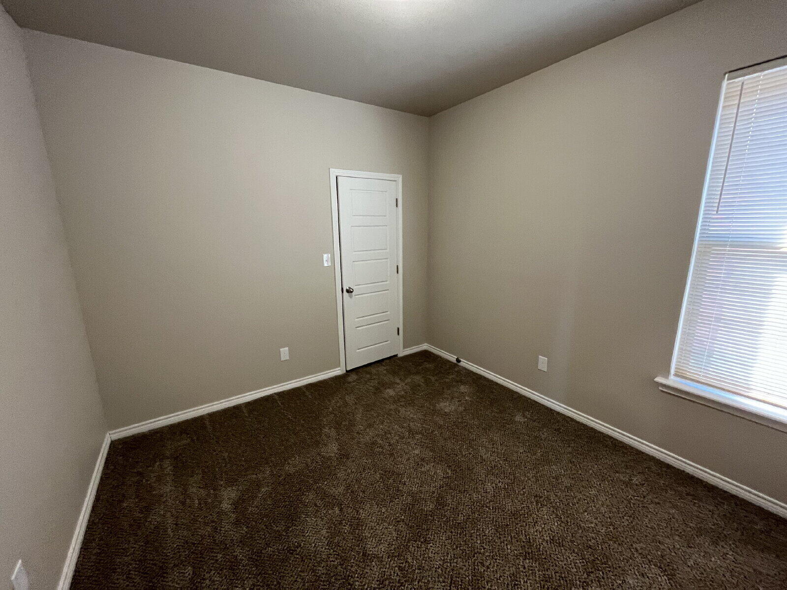 7010 12th Street Lubbock, TX 79416 - Photo 6 of 13 en empty room with windows