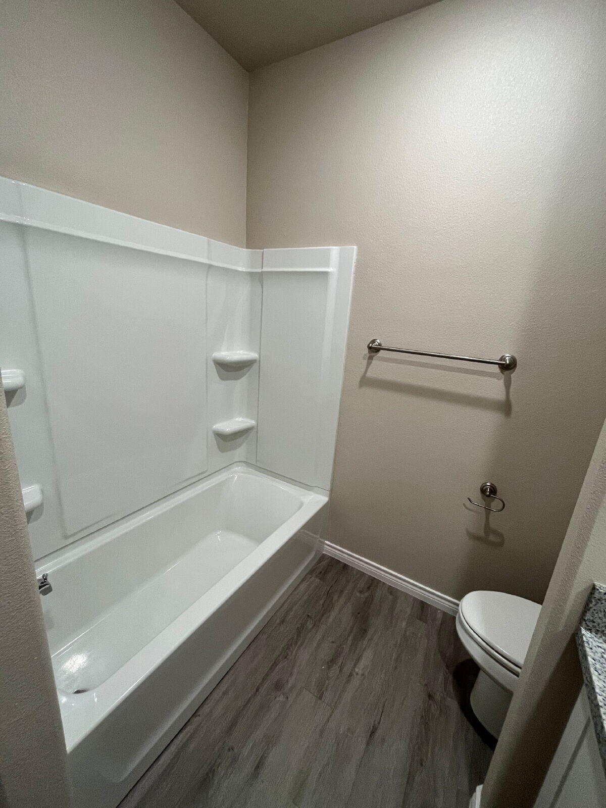 7010 12th Street Lubbock, TX 79416 - Photo 7 of 13 a bathroom with a sink and a toilet