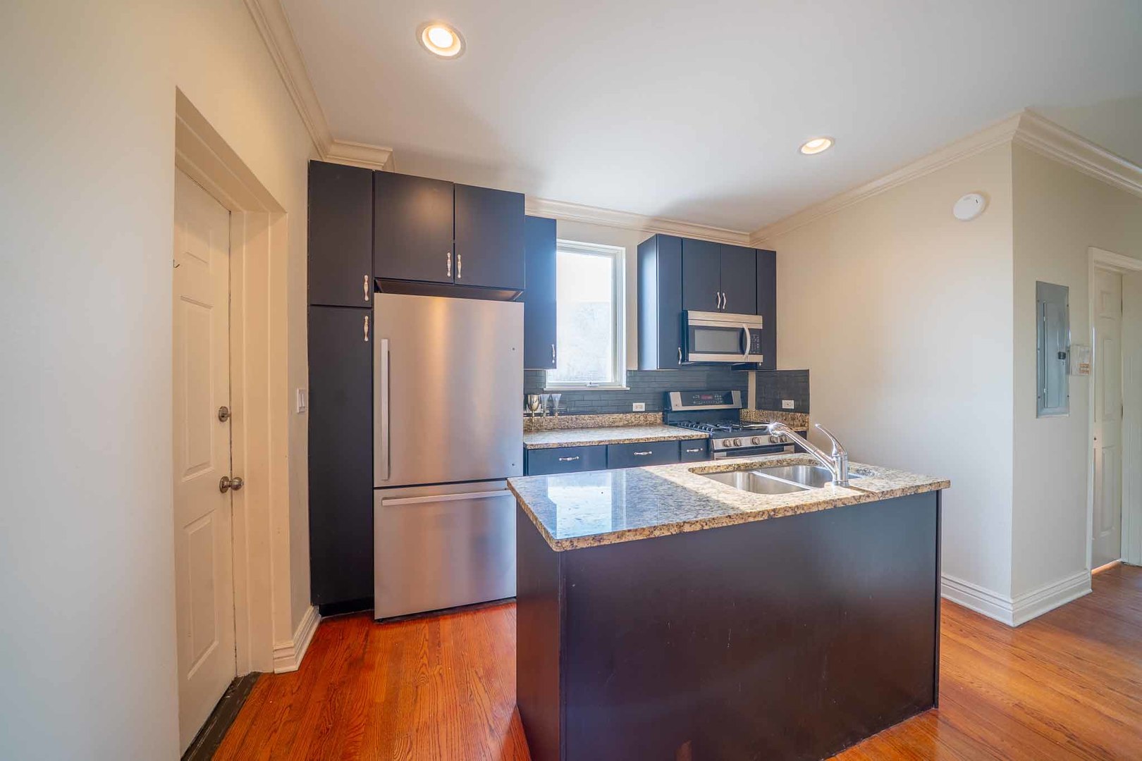 3123 West Washington Boulevard, Unit 3 Chicago, IL 60612 - Photo 11 of 24 a kitchen with a refrigerator and a sink