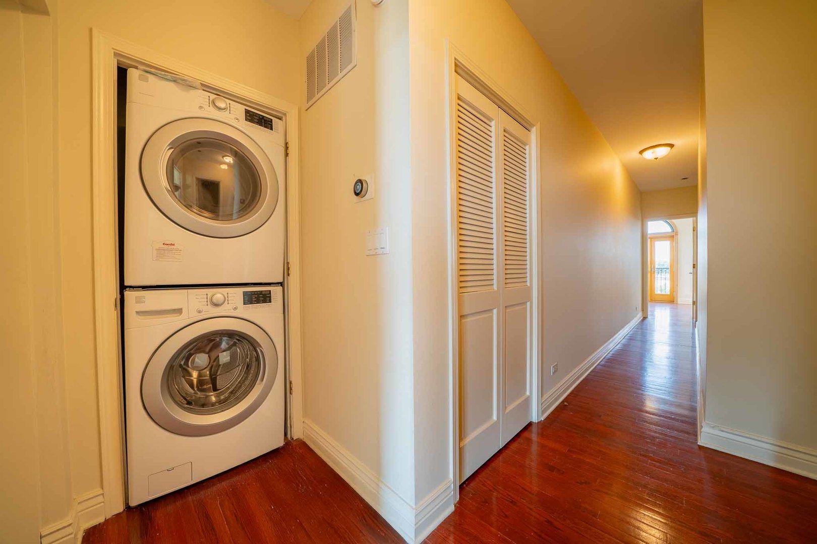 3123 West Washington Boulevard, Unit 3 Chicago, IL 60612 - Photo 14 of 24 a view of a hallway with washer and dryer