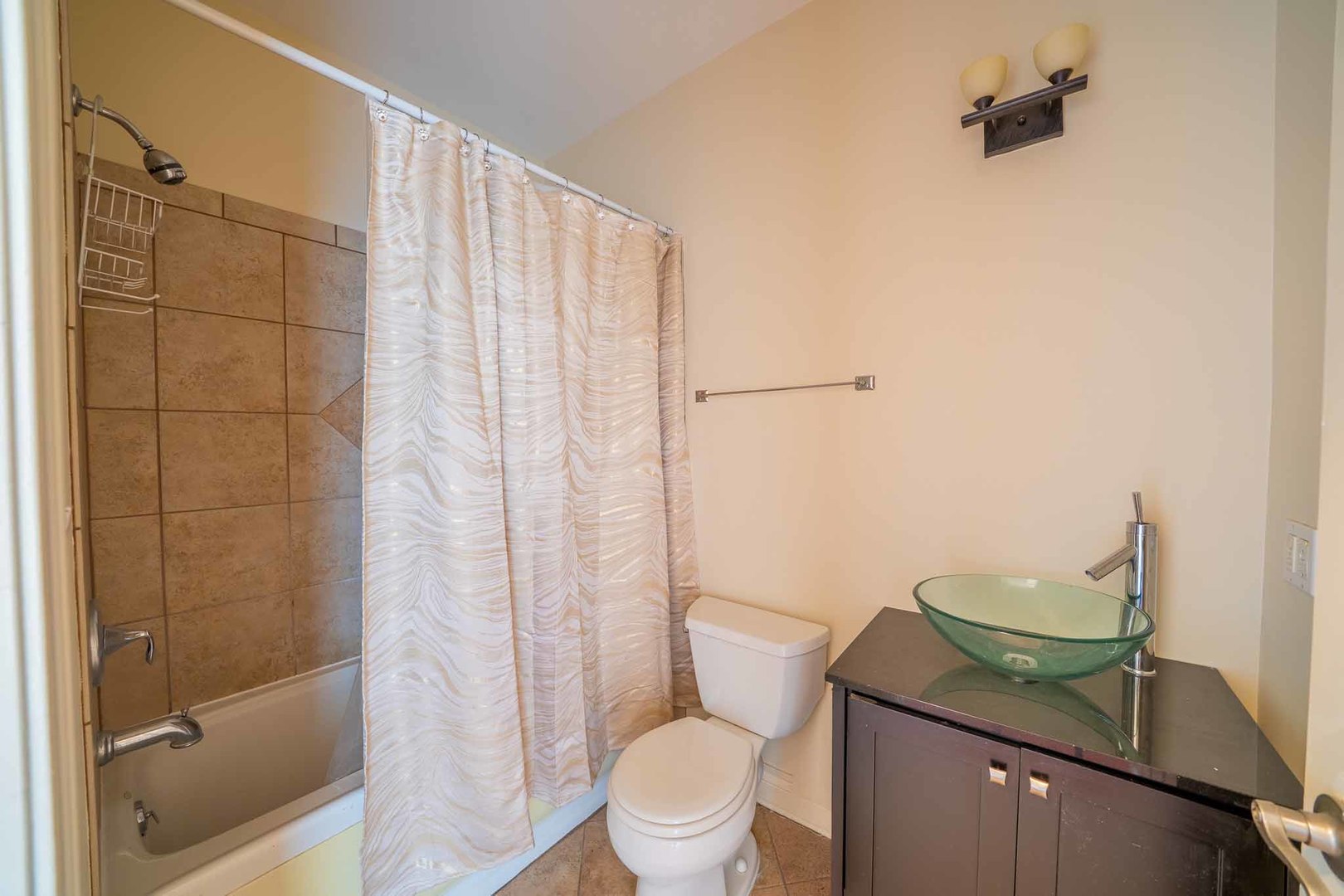 3123 West Washington Boulevard, Unit 3 Chicago, IL 60612 - Photo 18 of 24 a bathroom with a granite countertop sink toilet and shower