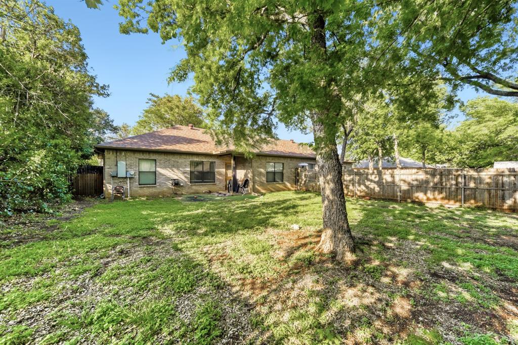 6525 Greenway Road Fort Worth, TX 76116 - Photo 28 of 29 a front view of a house with a garden