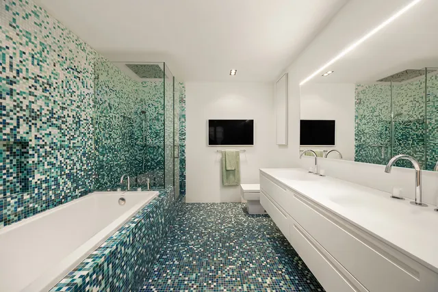 a bedroom with a bed and a chair