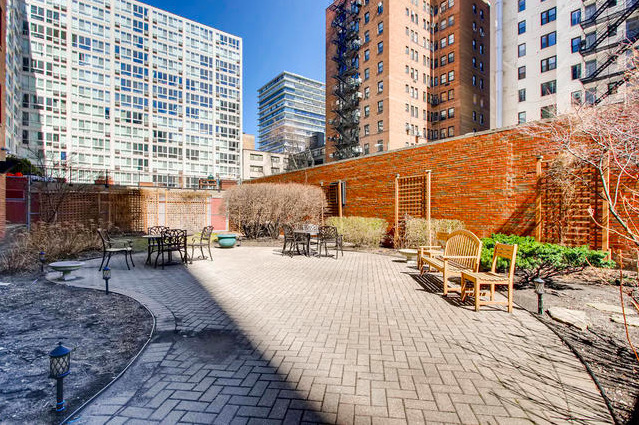 2909 North Sheridan Road, Unit 1810 Chicago, IL 60657 - Photo 8 of 9 a front view of a building with outdoor seating