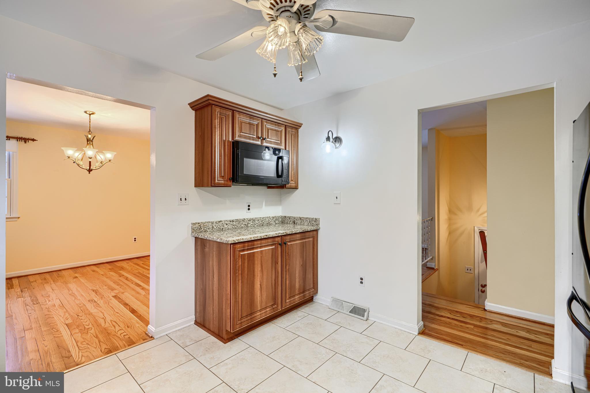 3528 Stansbury Mill Road Phoenix, MD 21131 - Photo 14 of 48 a spacious bathroom with a granite countertop sink and a mirror