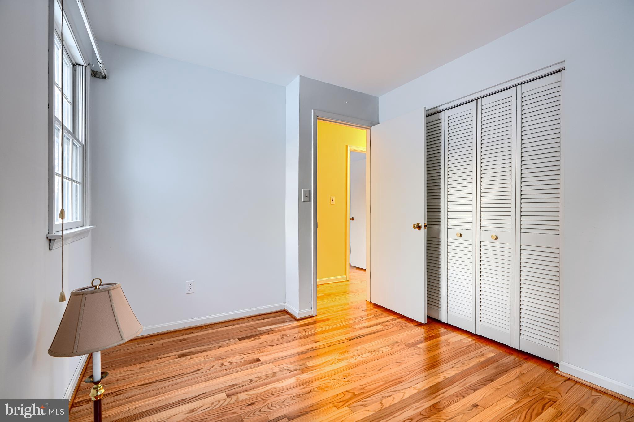 3528 Stansbury Mill Road Phoenix, MD 21131 - Photo 19 of 48 a view of empty room with wooden floor and fan