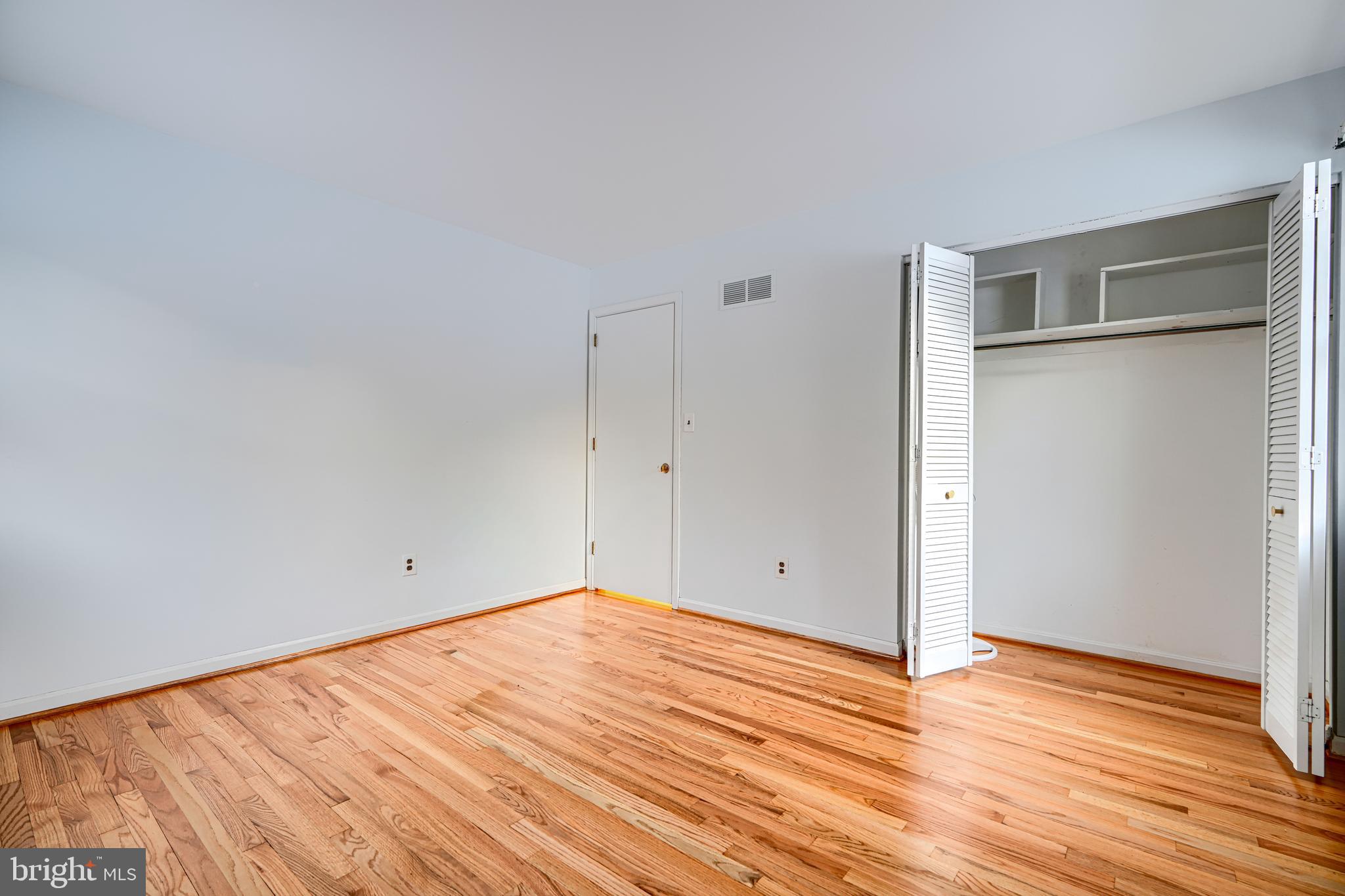 3528 Stansbury Mill Road Phoenix, MD 21131 - Photo 20 of 48 a view of empty room with wooden floor and entryway