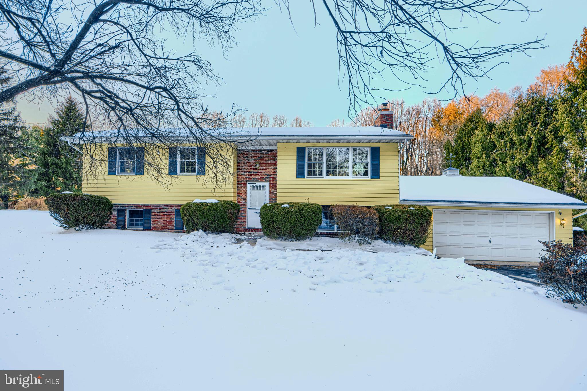 3528 Stansbury Mill Road Phoenix, MD 21131 - Photo 2 of 48 a front view of a house with a yard and a garage