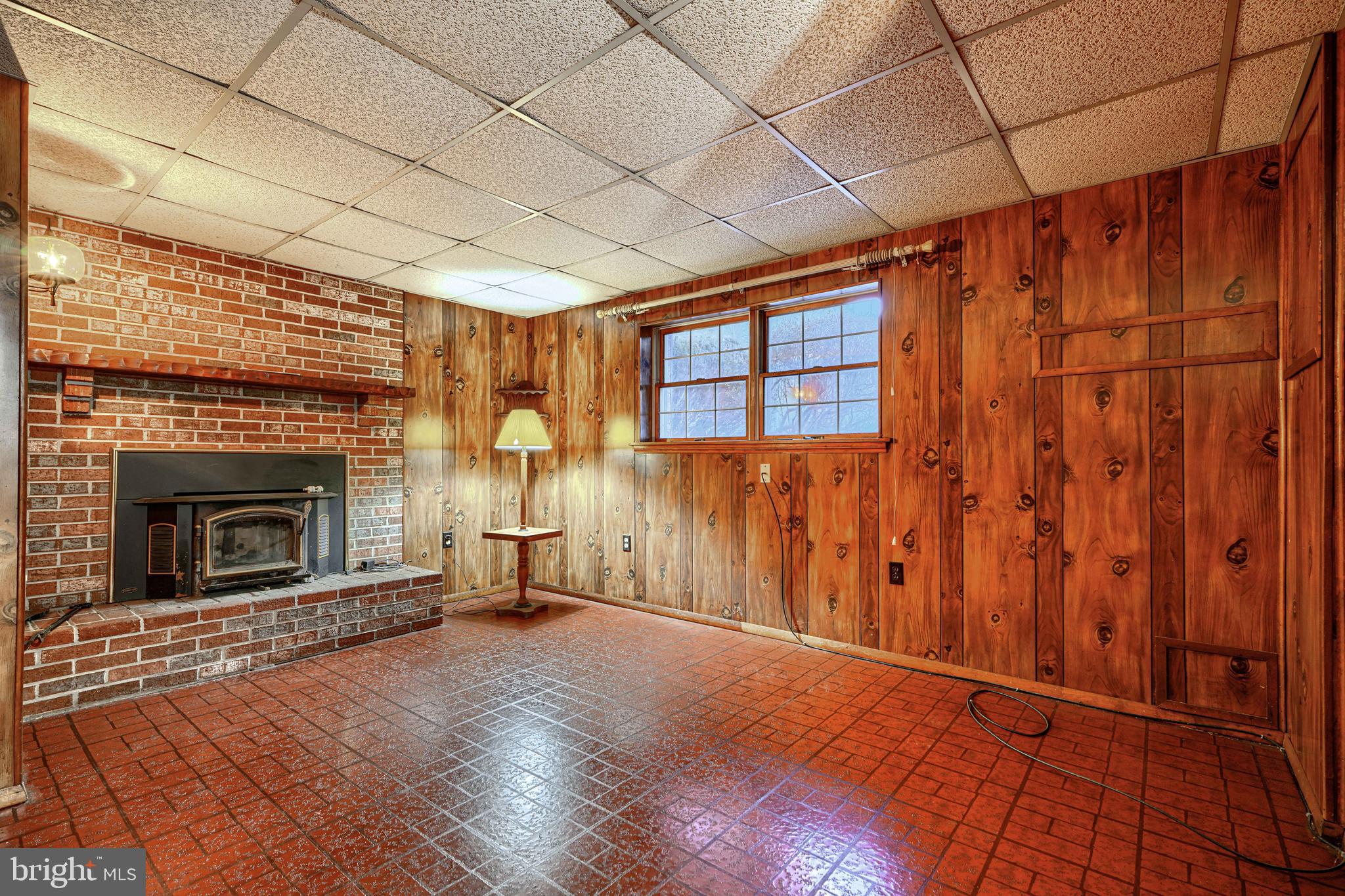 3528 Stansbury Mill Road Phoenix, MD 21131 - Photo 21 of 48 a view of a livingroom with wooden floor and a fireplace