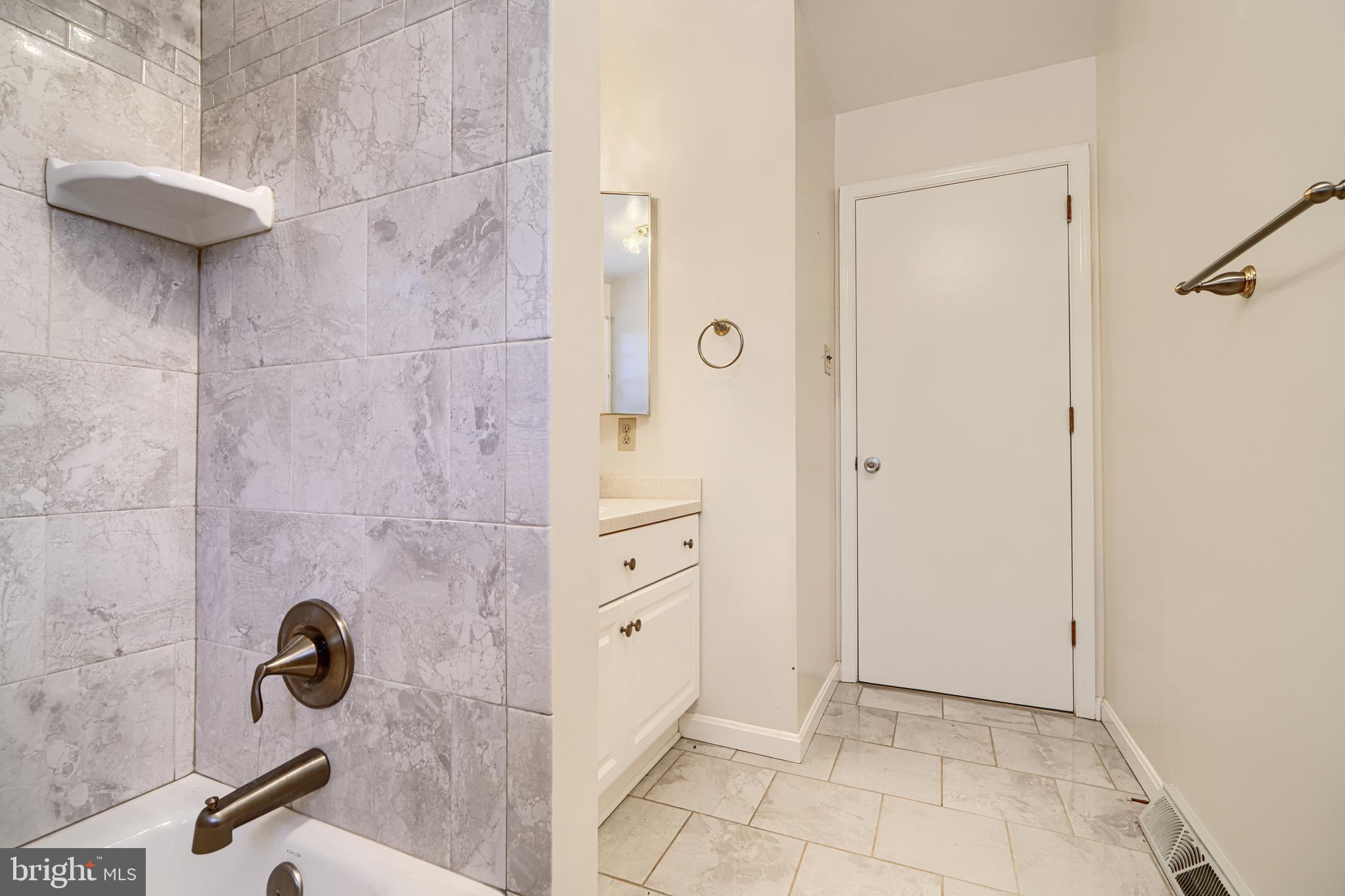 3528 Stansbury Mill Road Phoenix, MD 21131 - Photo 30 of 48 a bathroom with a granite countertop sink a mirror and shower