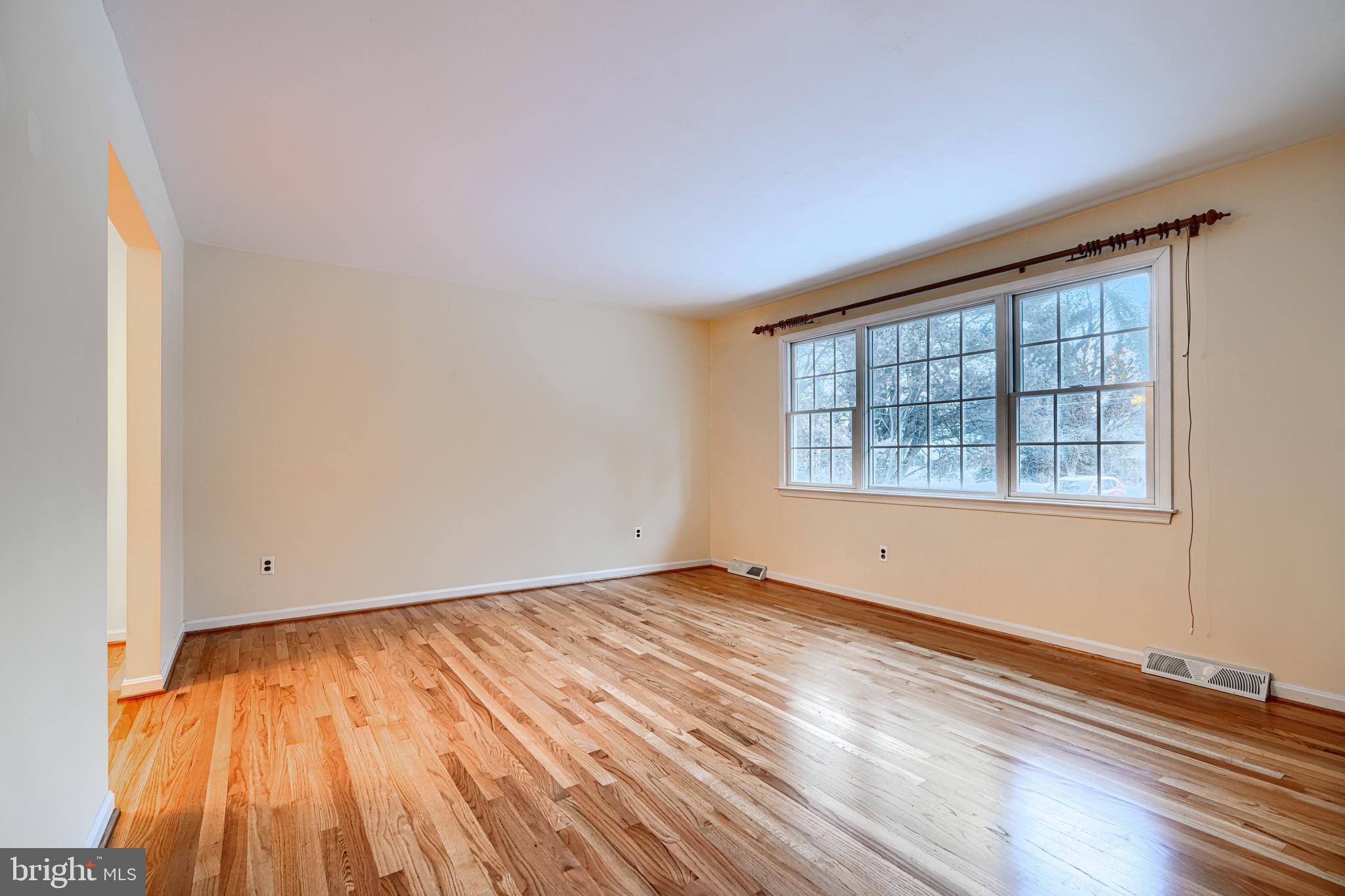 3528 Stansbury Mill Road Phoenix, MD 21131 - Photo 3 of 48 a view of empty room with wooden floor and fan