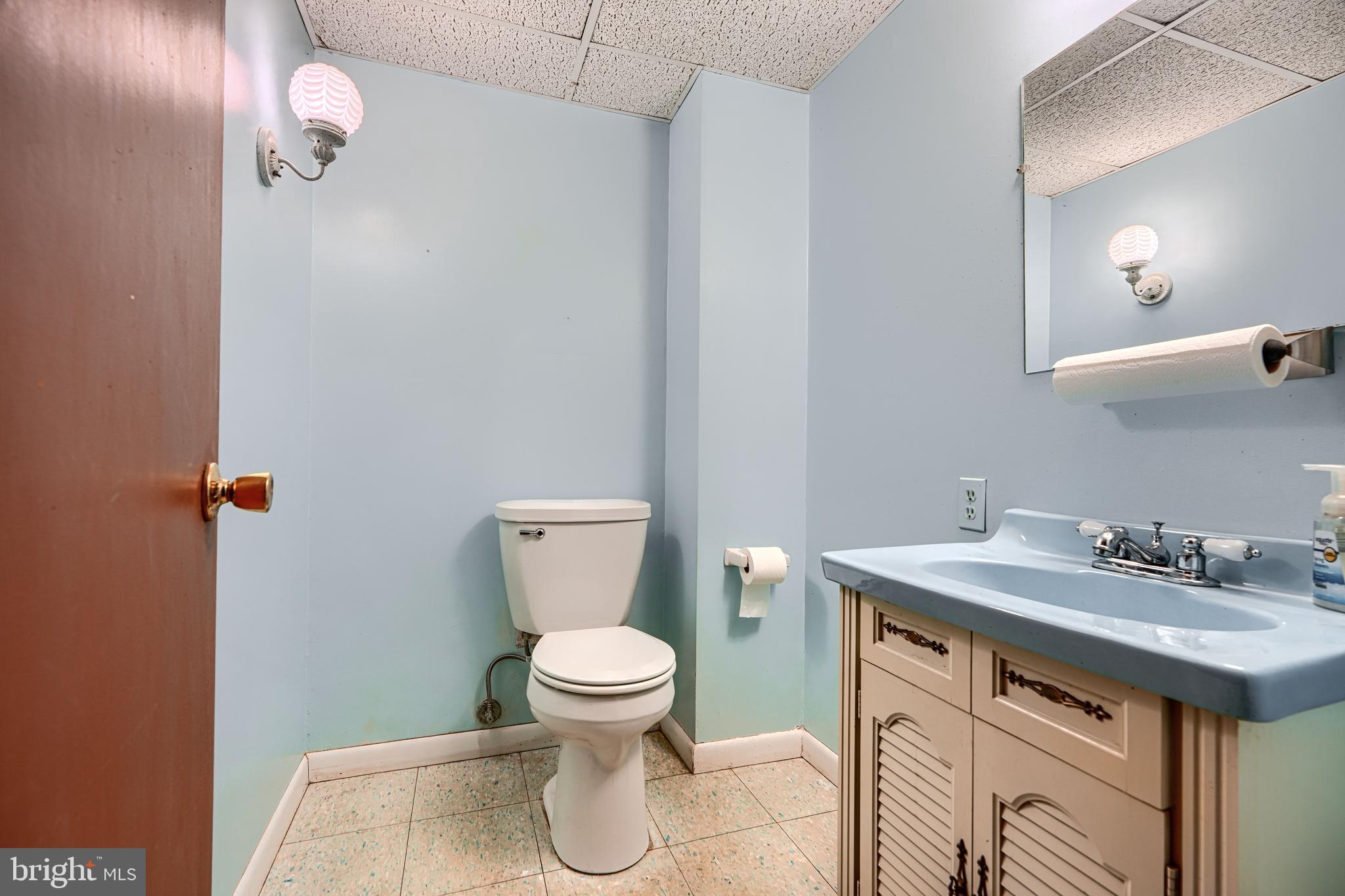 3528 Stansbury Mill Road Phoenix, MD 21131 - Photo 32 of 48 a bathroom with a sink vanity mirror and toilet