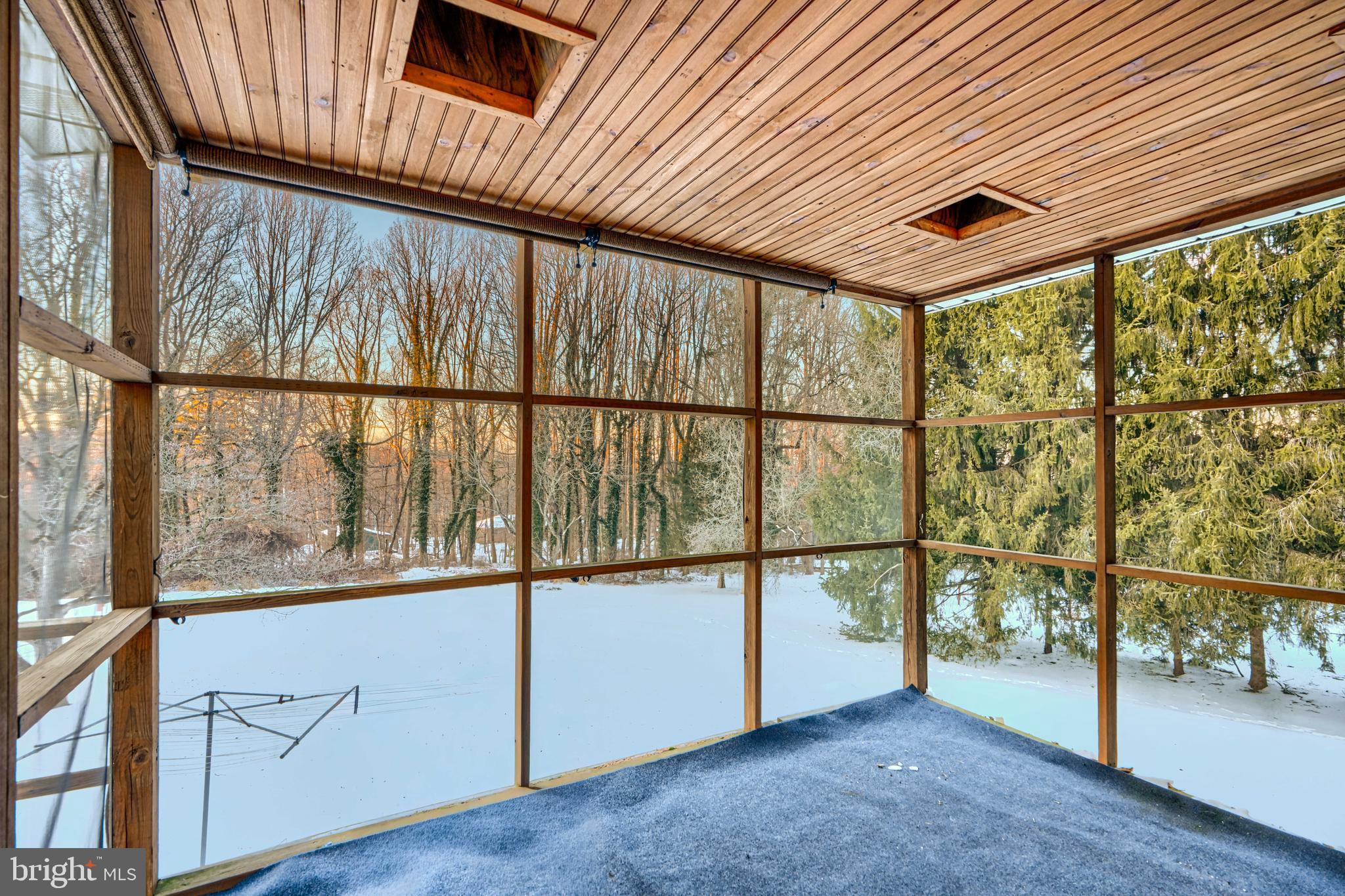 3528 Stansbury Mill Road Phoenix, MD 21131 - Photo 38 of 48 an empty room with wooden floor and windows