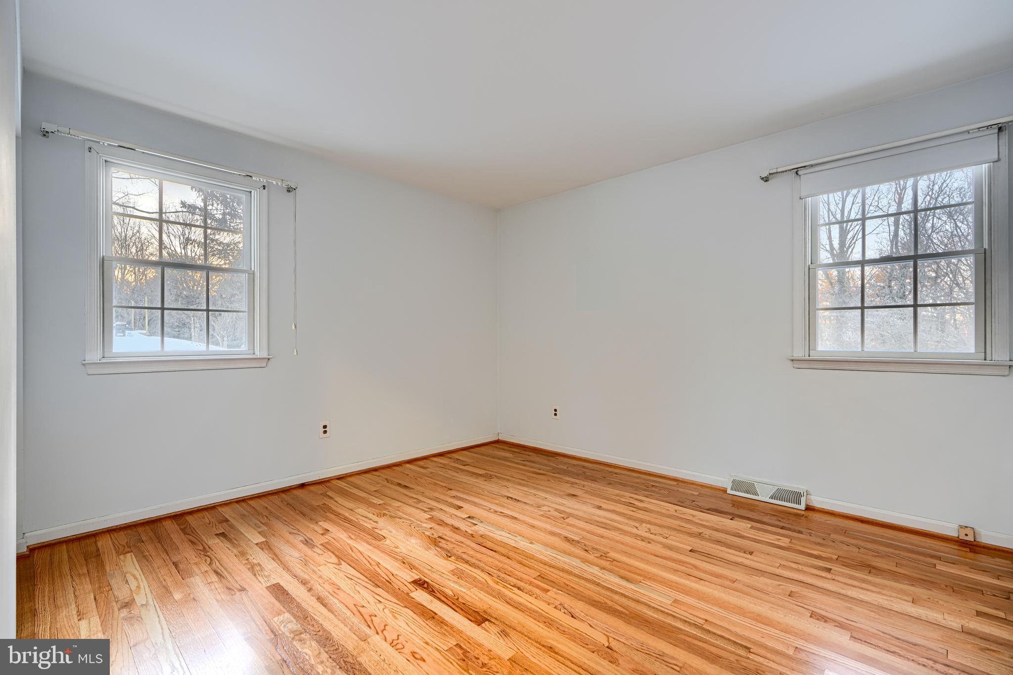 3528 Stansbury Mill Road Phoenix, MD 21131 - Photo 47 of 48 a view of empty room with wooden floor and fan