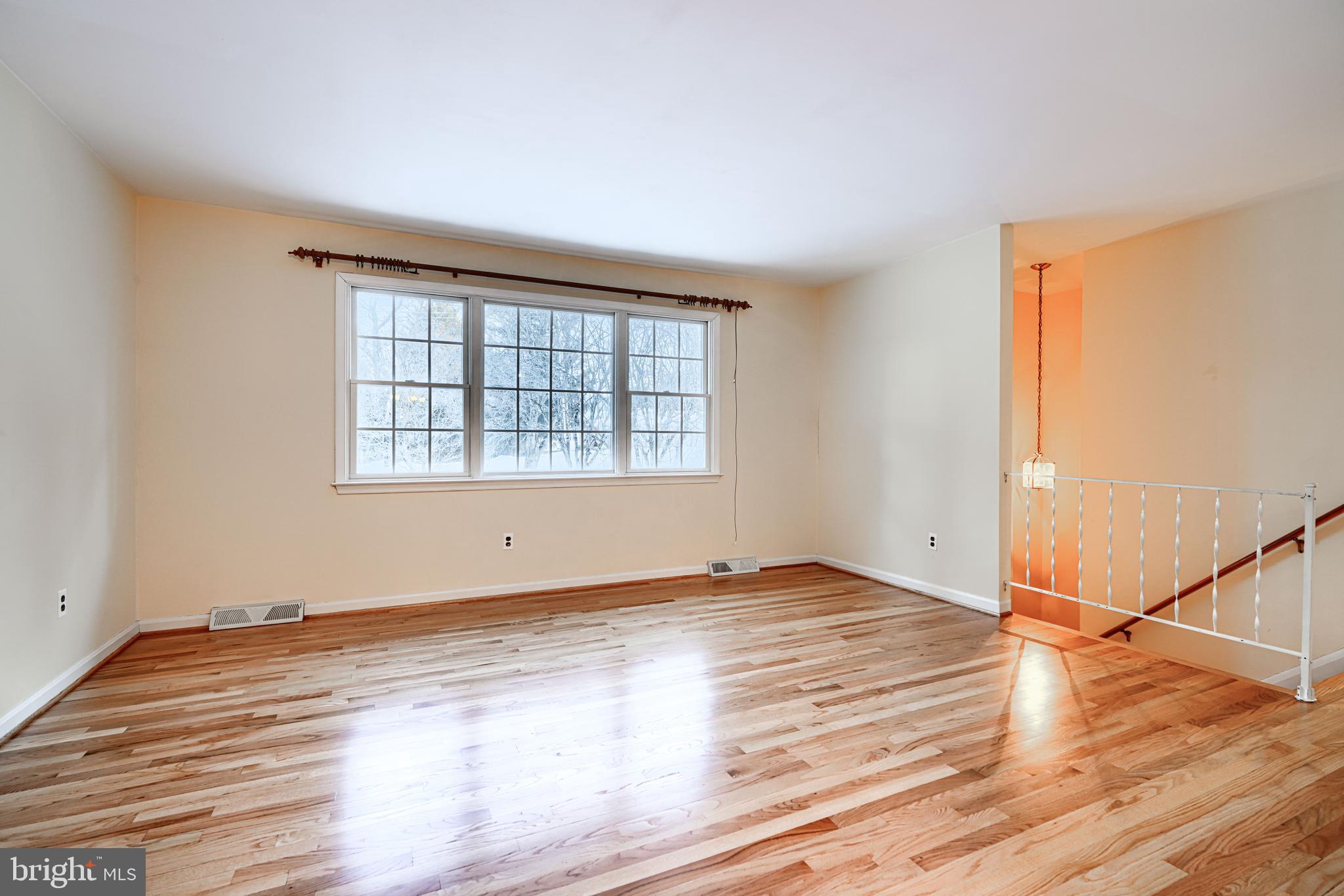3528 Stansbury Mill Road Phoenix, MD 21131 - Photo 5 of 48 a view of an empty room with wooden floor and a window