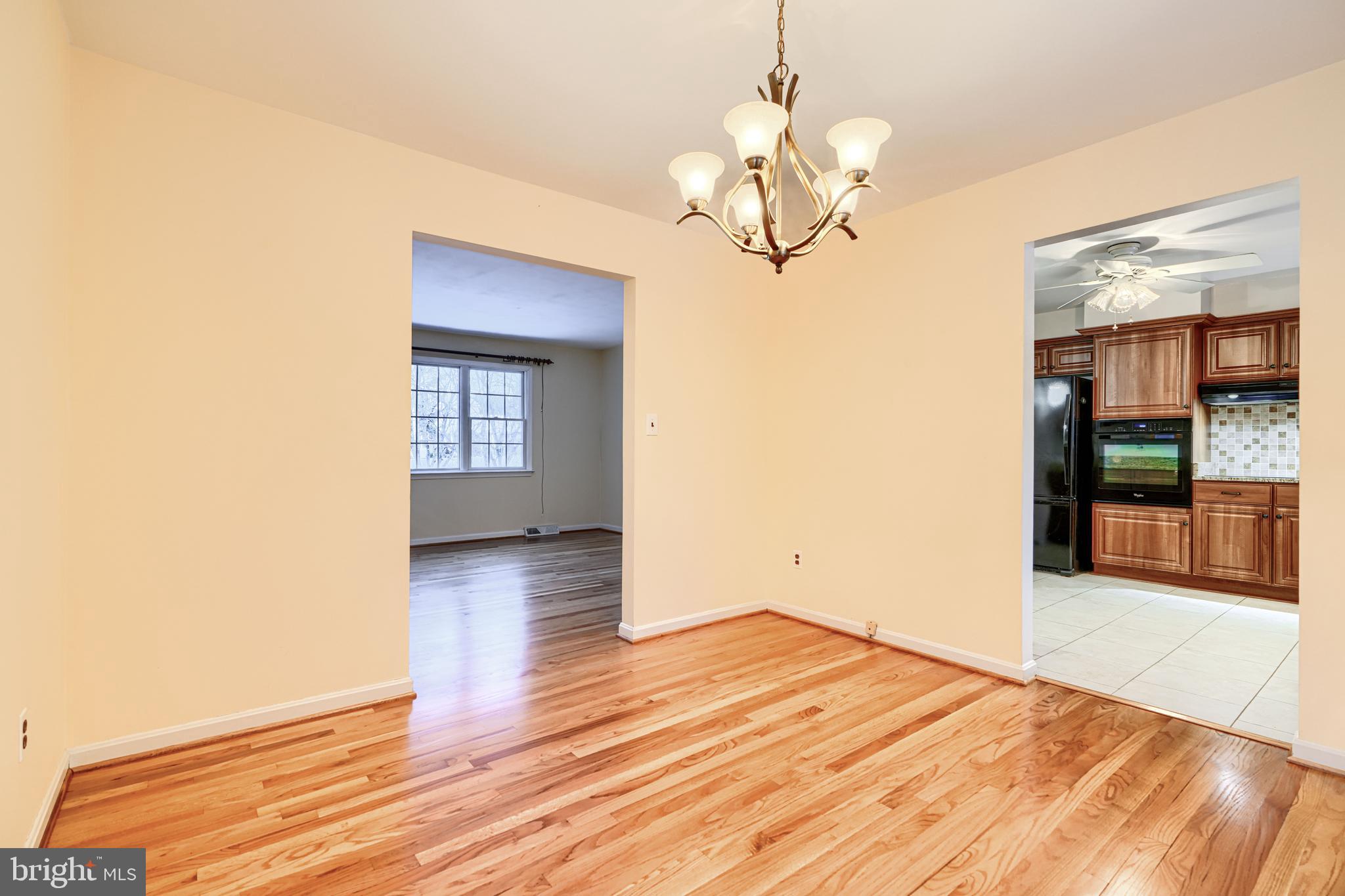 3528 Stansbury Mill Road Phoenix, MD 21131 - Photo 9 of 48 a view of livingroom with kitchen and wooden floor