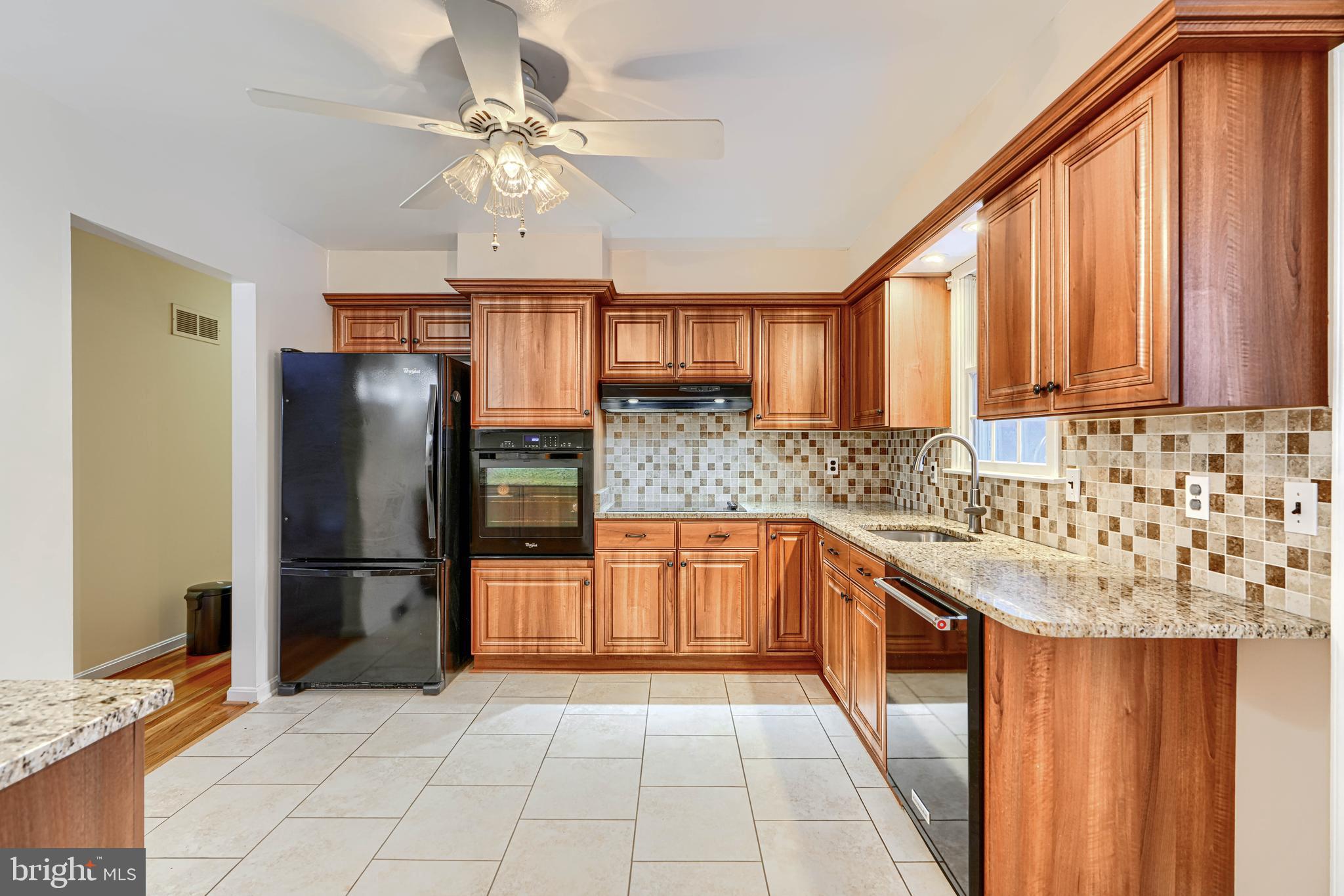 3528 Stansbury Mill Road Phoenix, MD 21131 - Photo 10 of 48 a kitchen with stainless steel appliances granite countertop a refrigerator and a sink