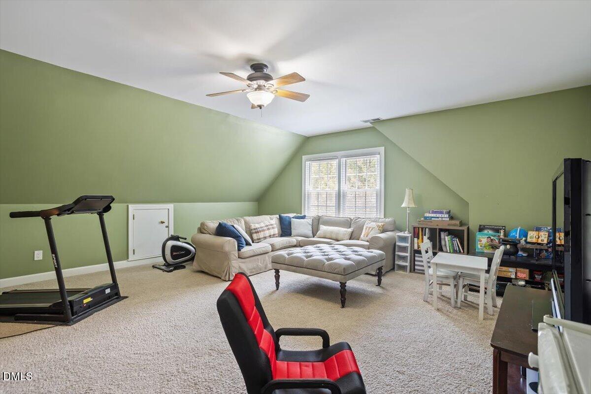 1808 Thorpshire Drive Raleigh, NC 27615 - Photo 14 of 17 a living room with furniture and a window