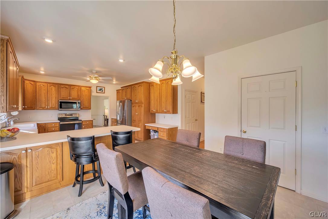 2715 Maple Drive Hellertown, PA 18055 - Photo 17 of 47 a view of a dining room with furniture and a chandelier