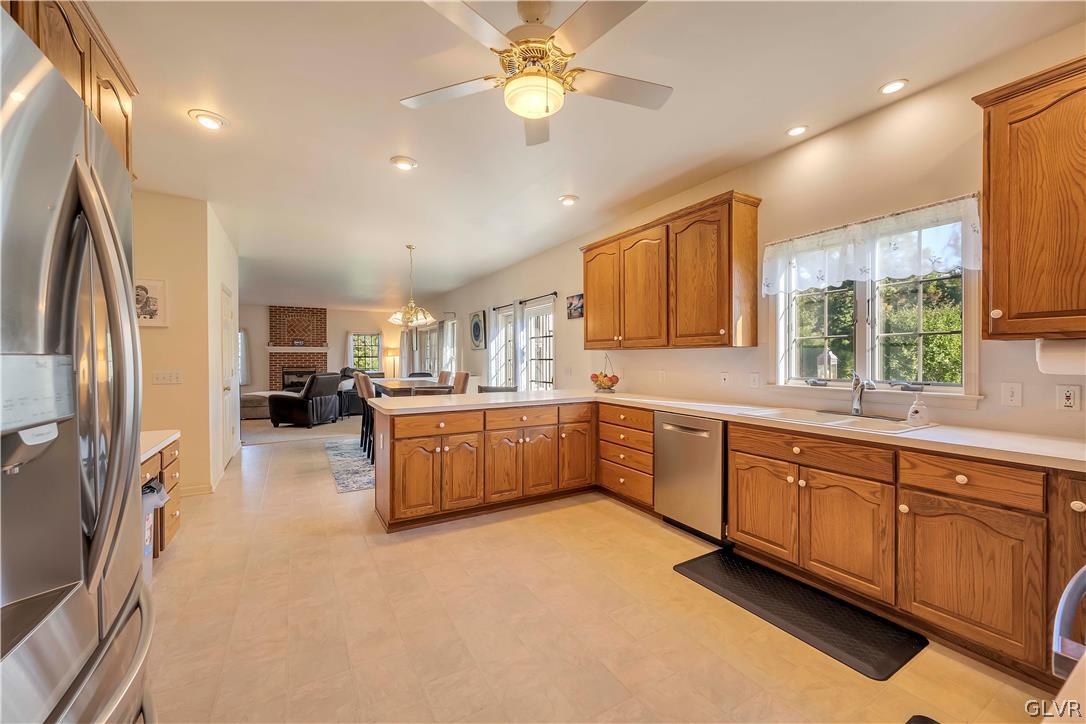 2715 Maple Drive Hellertown, PA 18055 - Photo 18 of 47 a large kitchen with a large window and stainless steel appliances