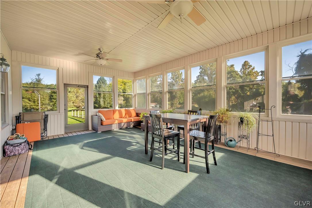 2715 Maple Drive Hellertown, PA 18055 - Photo 34 of 47 a living room with furniture a floor to ceiling window and floor to ceiling window