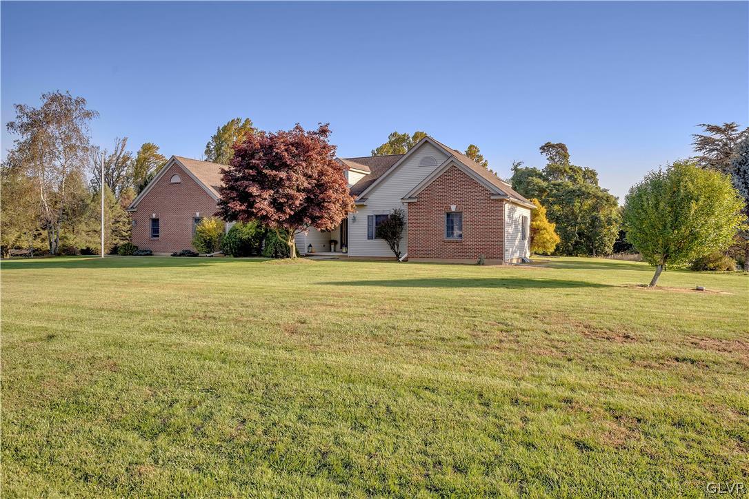 2715 Maple Drive Hellertown, PA 18055 - Photo 6 of 47 a front view of a house with a yard