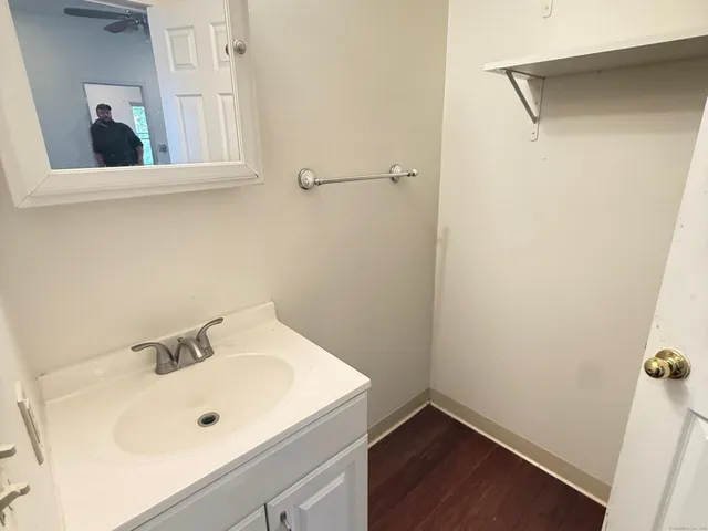 a bathroom with a sink and mirror