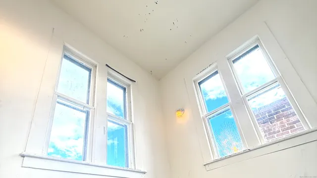 a view of an entryway with wooden floor