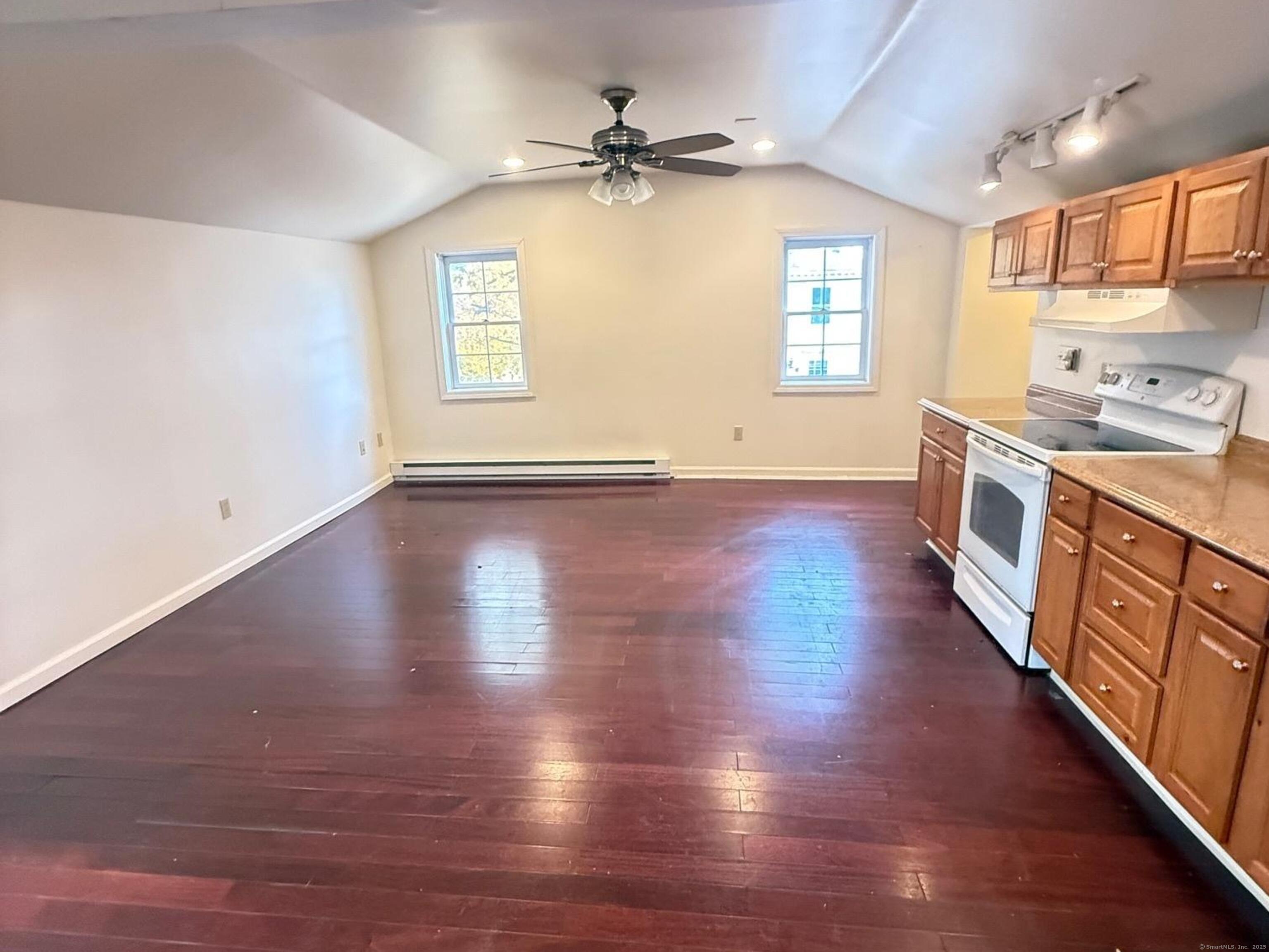 23 Hayward Avenue, Unit 5 Colchester, CT 06415 - Photo 2 of 20 an empty room with wooden floor and windows