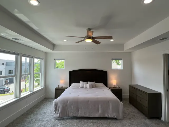 a bedroom with a bed and a couch