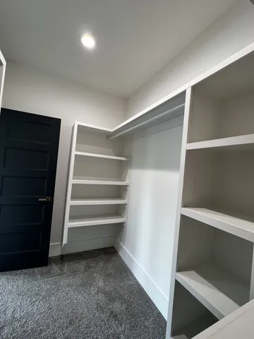 a bathroom with a double vanity sink and mirror